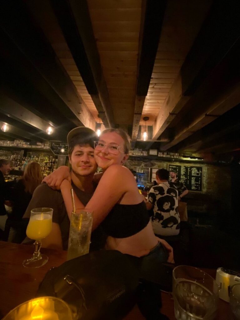 Girl with her boyfriend sitting in a bar