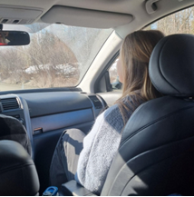 Girl sitting in a car.