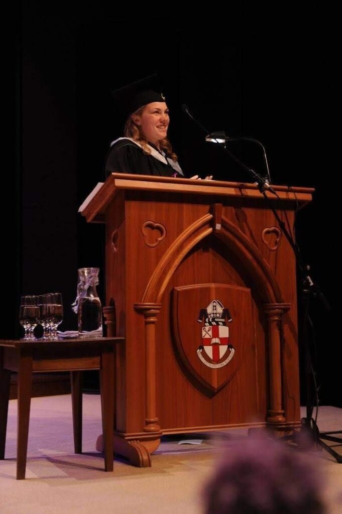 Girl on stage giving speech at Bishop's graduation ceremony