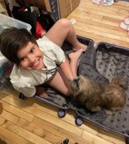 Kid in a suitcase laughing