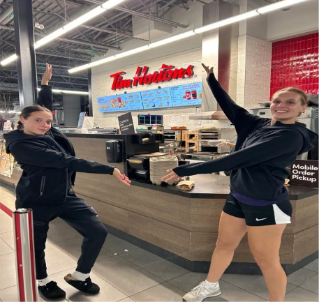 two girl showing the Tim Hortons