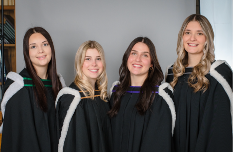 4 girls in graduation gowns
